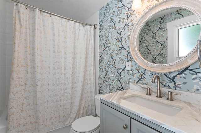 3620 W San Pedro St, Tampa, FL 33629 - bathroom featuring wallpapered walls, vanity, toilet, and shower / bath combo
