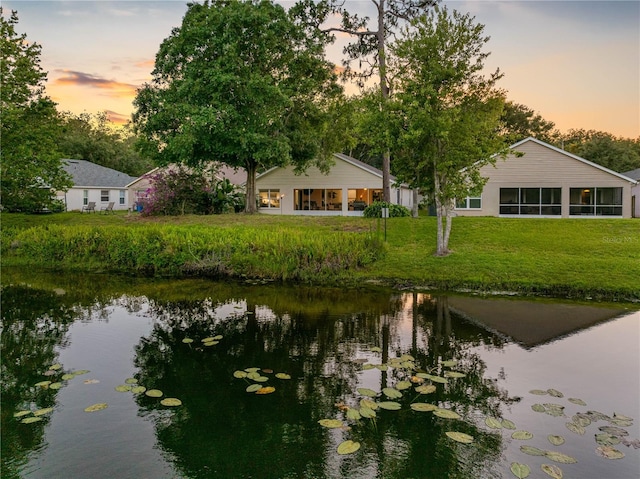 dock with a water view and a yard
