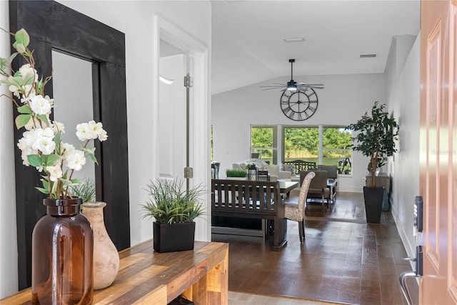 dining area featuring ceiling fan, vaulted ceiling, wood finished floors, and baseboards