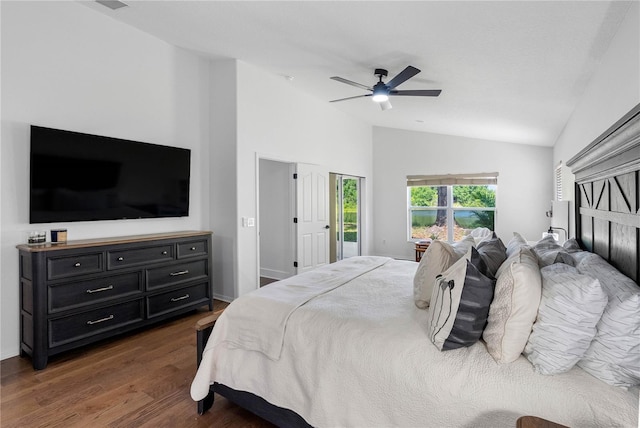bedroom with lofted ceiling, dark wood-type flooring, a ceiling fan, and baseboards