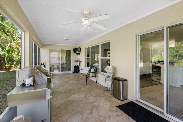 sunroom / solarium with ceiling fan