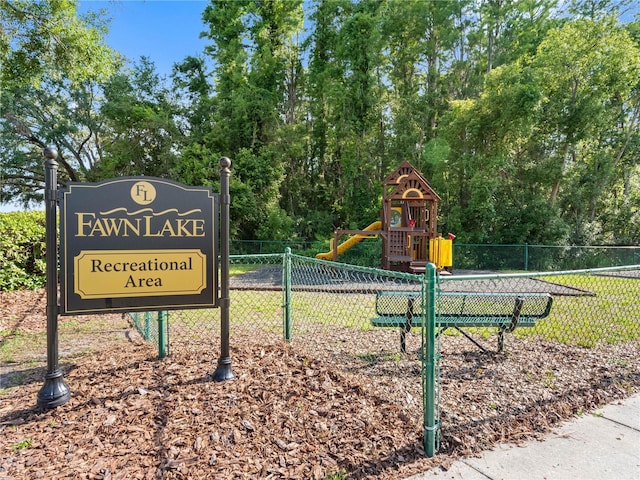view of community with fence