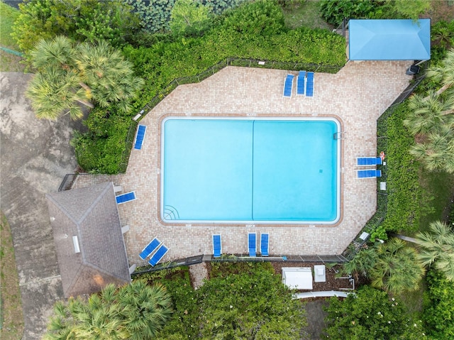 aerial view of property and surrounding area with a pool