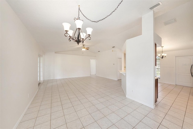 31645 Bugle Ln, Wesley Chapel, FL 33543 - spare room with a chandelier, vaulted ceiling, and light tile patterned floors