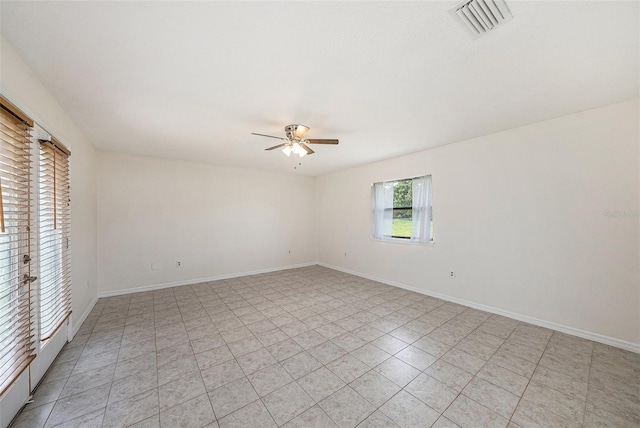 31645 Bugle Ln, Wesley Chapel, FL 33543 - empty room with ceiling fan and light tile patterned floors