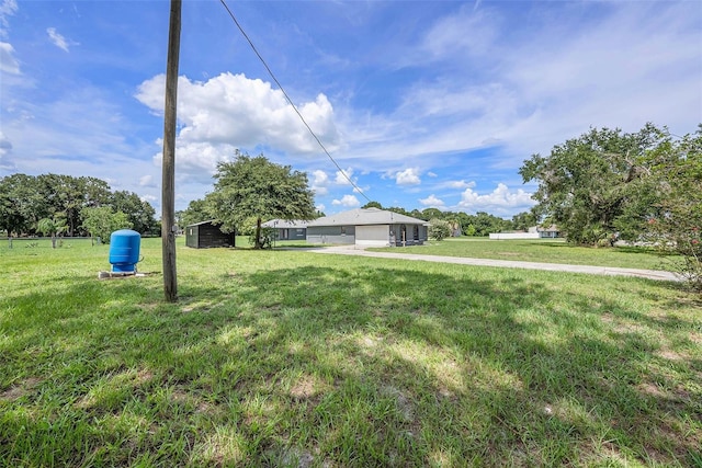 31645 Bugle Ln, Wesley Chapel, FL 33543 - view of front facade with a garage and a front yard