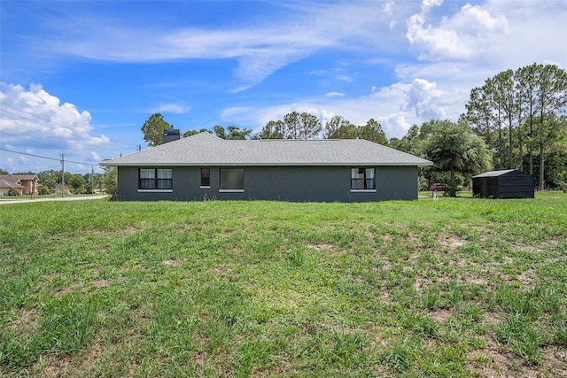 31645 Bugle Ln, Wesley Chapel, FL 33543 - view of side of property featuring a storage unit, a yard, and stucco siding