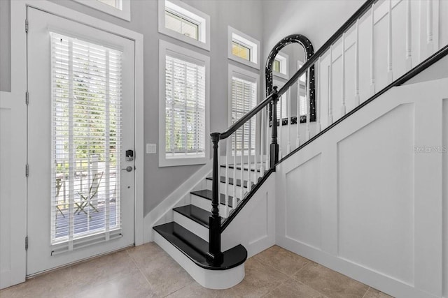 340 Sapphire Lake Dr Unit 202, Bradenton, FL 34209 - foyer entrance featuring light tile patterned floors and stairway