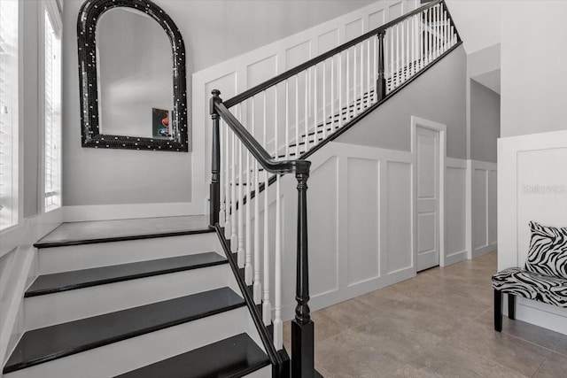 340 Sapphire Lake Dr Unit 202, Bradenton, FL 34209 - stairs with a decorative wall and a wainscoted wall