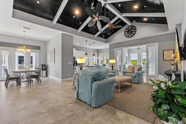 340 Sapphire Lake Dr Unit 202, Bradenton, FL 34209 - living room featuring a ceiling fan, a chandelier, baseboards, high vaulted ceiling, and beam ceiling