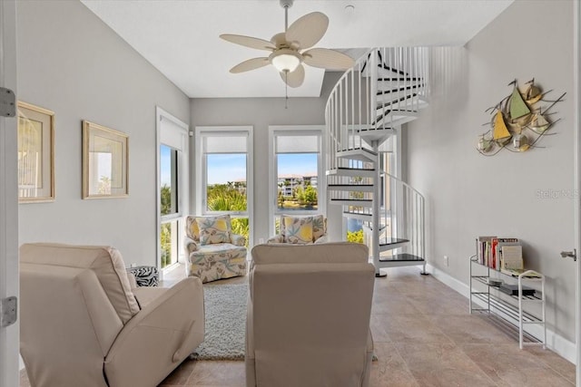 340 Sapphire Lake Dr Unit 202, Bradenton, FL 34209 - living area featuring a ceiling fan, baseboards, and stairs