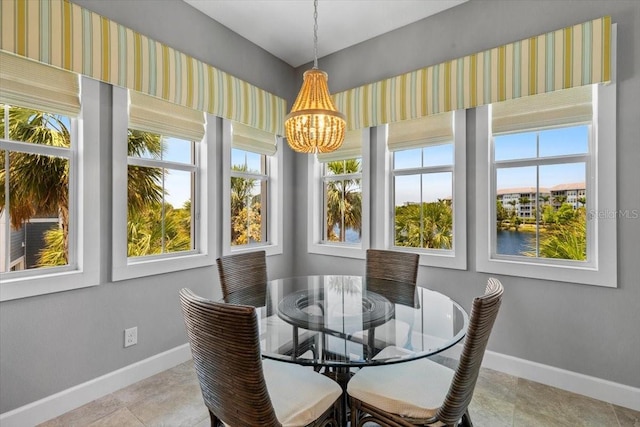 340 Sapphire Lake Dr Unit 202, Bradenton, FL 34209 - dining room featuring baseboards, a chandelier, and tile patterned flooring