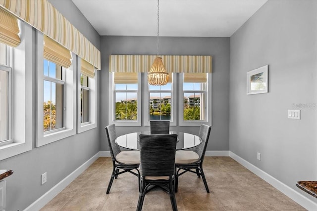 340 Sapphire Lake Dr Unit 202, Bradenton, FL 34209 - dining space with plenty of natural light, a chandelier, and baseboards