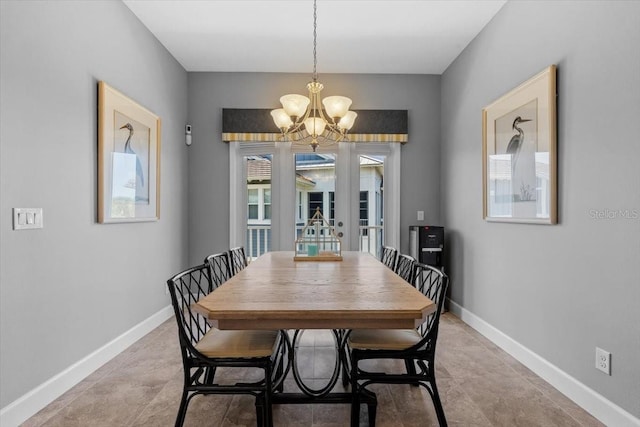 340 Sapphire Lake Dr Unit 202, Bradenton, FL 34209 - dining room with a chandelier, baseboards, and french doors