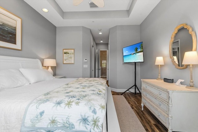 340 Sapphire Lake Dr Unit 202, Bradenton, FL 34209 - bedroom featuring dark wood-type flooring, recessed lighting, a raised ceiling, and baseboards
