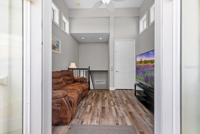 340 Sapphire Lake Dr Unit 202, Bradenton, FL 34209 - living area with wood finished floors, a towering ceiling, and a ceiling fan