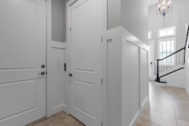340 Sapphire Lake Dr Unit 202, Bradenton, FL 34209 - corridor featuring light tile patterned floors, stairway, and baseboards