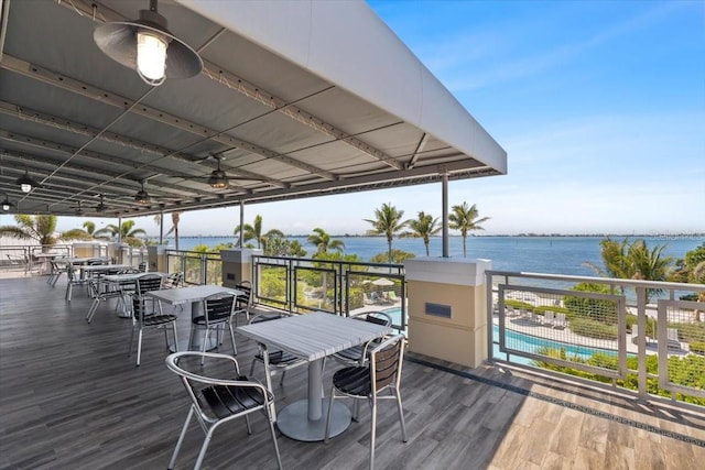 340 Sapphire Lake Dr Unit 202, Bradenton, FL 34209 - deck featuring a ceiling fan, a water view, outdoor dining space, and a community pool