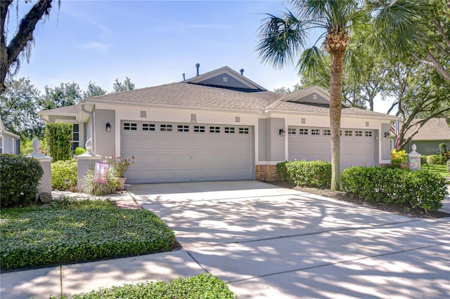 6030 Sandhill Ridge Dr, Lithia, FL 33547 - ranch-style home featuring an attached garage, driveway, stucco siding, and a shingled roof