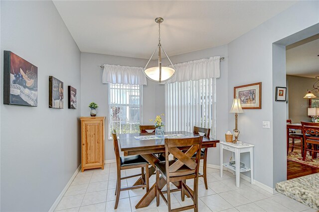 6030 Sandhill Ridge Dr, Lithia, FL 33547 - dining space featuring light tile patterned flooring and baseboards