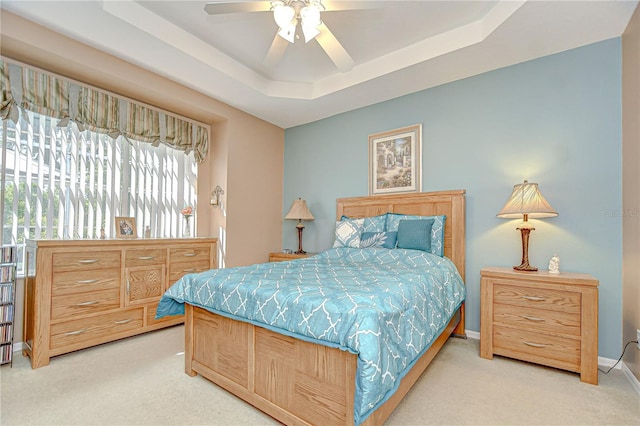 6030 Sandhill Ridge Dr, Lithia, FL 33547 - carpeted bedroom with a tray ceiling, ceiling fan, and baseboards