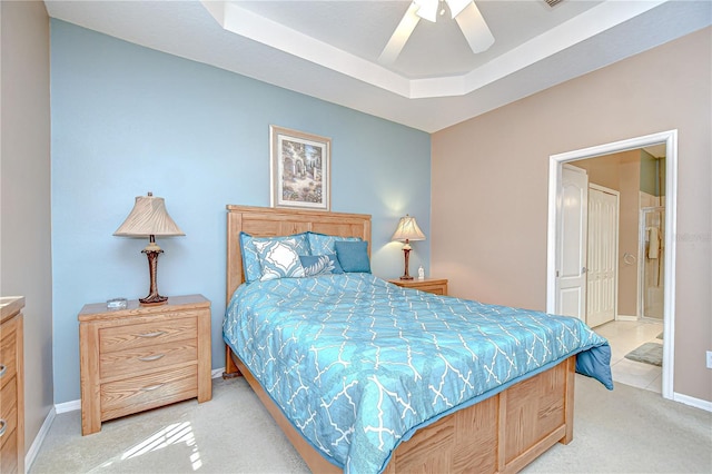 6030 Sandhill Ridge Dr, Lithia, FL 33547 - bedroom with light carpet, ensuite bath, baseboards, and ceiling fan