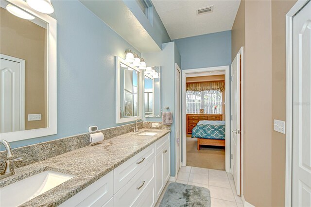 6030 Sandhill Ridge Dr, Lithia, FL 33547 - ensuite bathroom featuring tile patterned flooring and double vanity