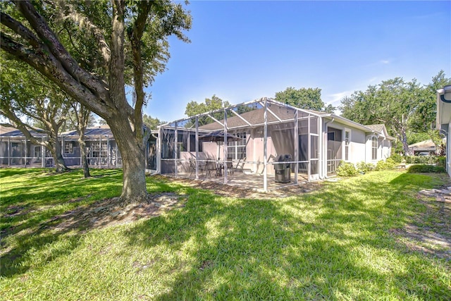 6030 Sandhill Ridge Dr, Lithia, FL 33547 - rear view of property with a yard, a patio area, and a lanai