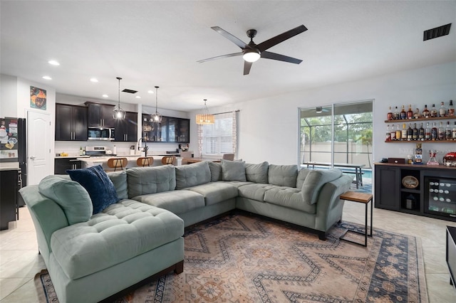 11550 Lake Lucaya Dr, Riverview, FL 33579 - living area featuring a dry bar, a ceiling fan, recessed lighting, and light tile patterned flooring