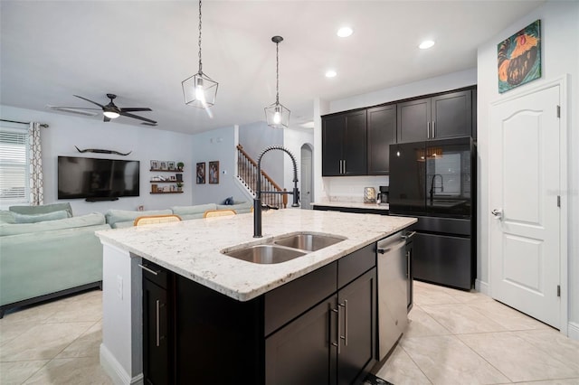 11550 Lake Lucaya Dr, Riverview, FL 33579 - kitchen with black refrigerator, a sink, dishwasher, a center island with sink, and ceiling fan