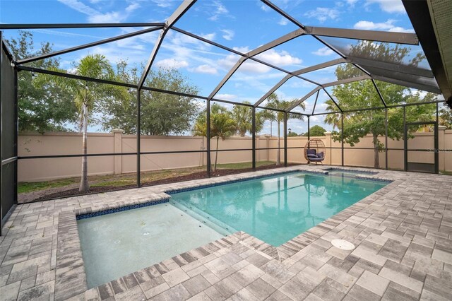 11550 Lake Lucaya Dr, Riverview, FL 33579 - view of pool with a patio area, a fenced backyard, a pool with connected hot tub, and glass enclosure