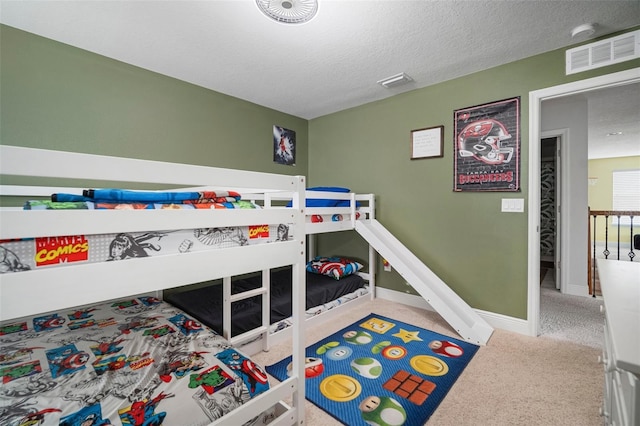 11550 Lake Lucaya Dr, Riverview, FL 33579 - carpeted bedroom with a textured ceiling and baseboards