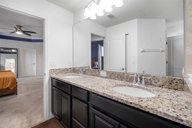 11550 Lake Lucaya Dr, Riverview, FL 33579 - ensuite bathroom with a ceiling fan and double vanity