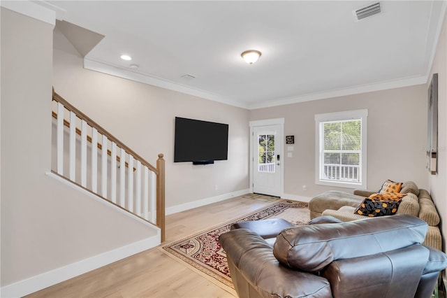 340 6th St E, Bradenton, FL 34208 - living room with ornamental molding, baseboards, light wood-style flooring, recessed lighting, and stairs
