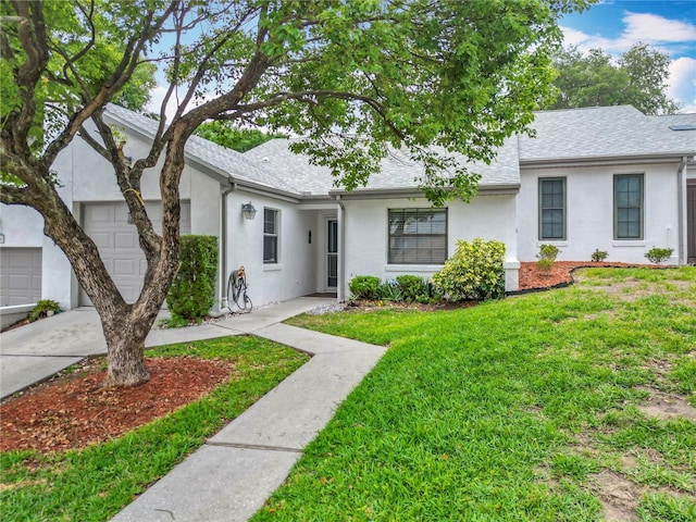 3328 S Whitechappel Pt, Inverness, FL 34452 - view of front of property with stucco siding, a front yard, a shingled roof, and a garage