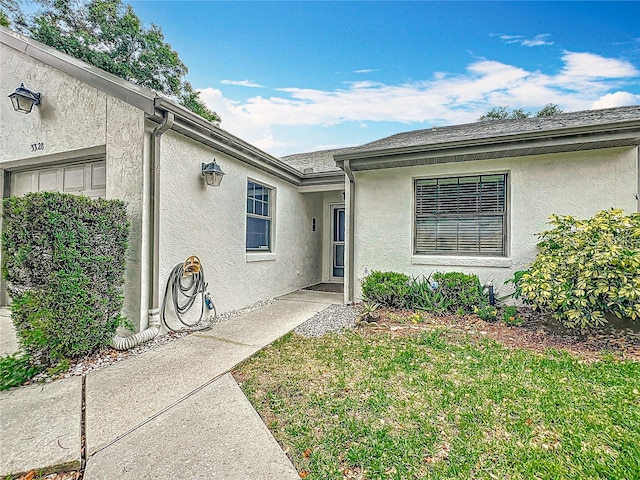 3328 S Whitechappel Pt, Inverness, FL 34452 - view of exterior entry featuring stucco siding