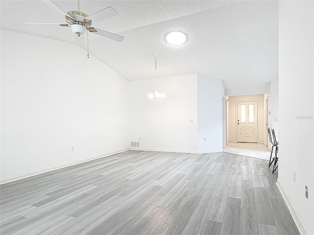 3328 S Whitechappel Pt, Inverness, FL 34452 - spare room with light wood-style flooring, a chandelier, ceiling fan, baseboards, and lofted ceiling