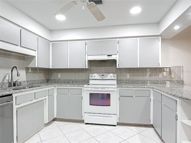 3328 S Whitechappel Pt, Inverness, FL 34452 - kitchen with electric stove, a sink, under cabinet range hood, stainless steel dishwasher, and decorative backsplash