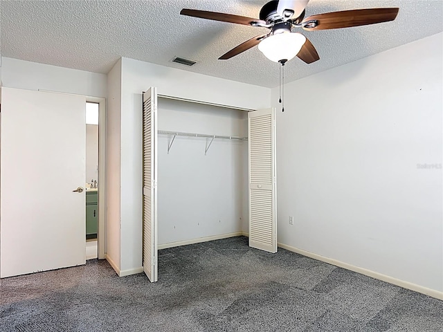 3328 S Whitechappel Pt, Inverness, FL 34452 - unfurnished bedroom featuring carpet floors, a closet, a textured ceiling, a ceiling fan, and baseboards