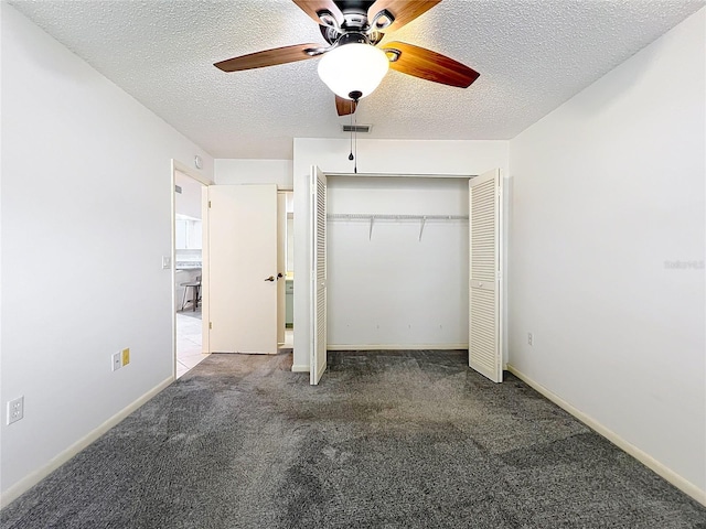 3328 S Whitechappel Pt, Inverness, FL 34452 - unfurnished bedroom with carpet, a closet, a textured ceiling, a ceiling fan, and baseboards