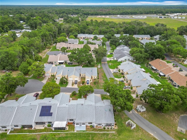 3328 S Whitechappel Pt, Inverness, FL 34452 - aerial overview of property's location featuring nearby suburban area and a heavily wooded area
