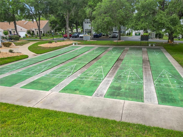 3328 S Whitechappel Pt, Inverness, FL 34452 - view of home's community with a yard and shuffleboard