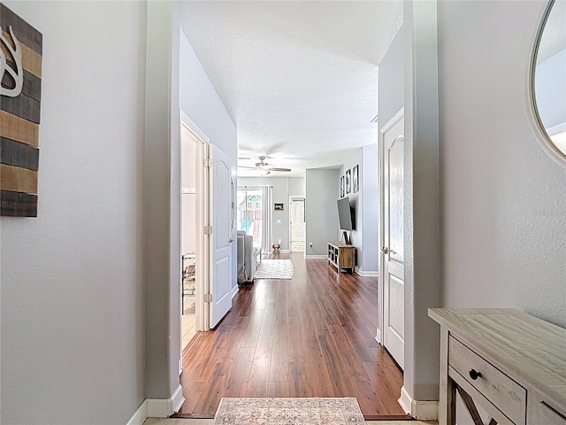 3512 Gerrads Cross Ct, Land O Lakes, FL 34638 - hall featuring dark wood-style flooring and baseboards