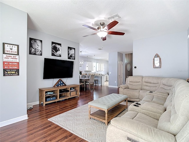 3512 Gerrads Cross Ct, Land O Lakes, FL 34638 - living area featuring a ceiling fan and dark wood finished floors