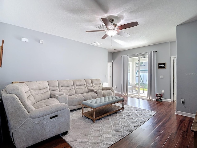 3512 Gerrads Cross Ct, Land O Lakes, FL 34638 - living room featuring ceiling fan, wood finished floors, and a textured ceiling
