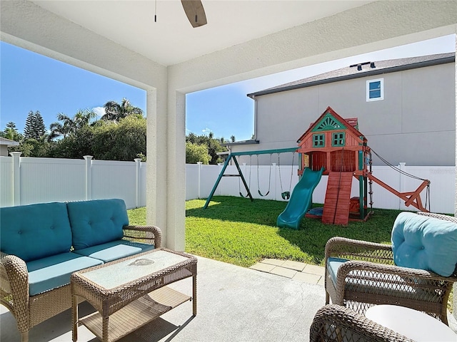 3512 Gerrads Cross Ct, Land O Lakes, FL 34638 - fenced backyard with a playground, a patio area, an outdoor hangout area, and ceiling fan