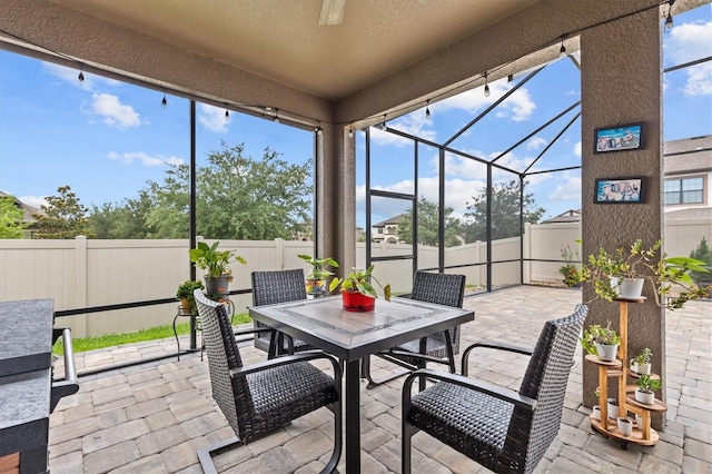 sunroom / solarium with outdoor dining area