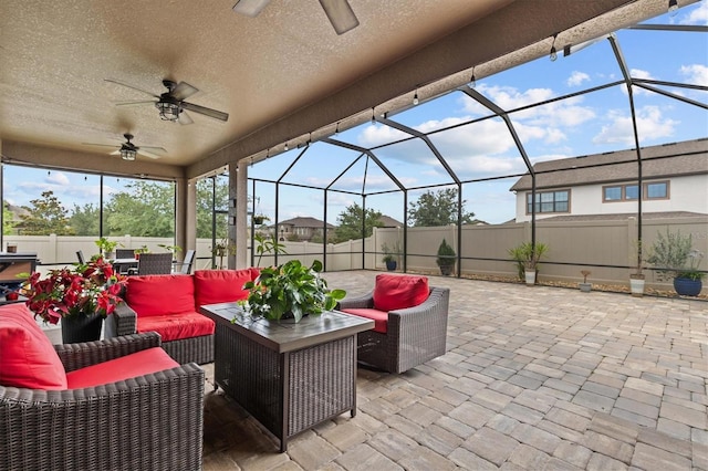 view of patio / terrace featuring a ceiling fan, a fenced backyard, and outdoor lounge area