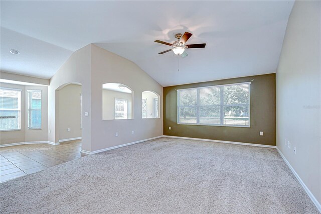11567 Weston Course Loop, Riverview, FL 33579 - spare room featuring light carpet, a ceiling fan, vaulted ceiling, and baseboards