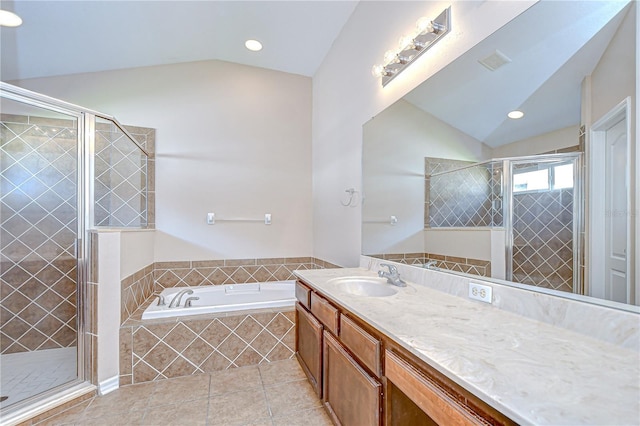11567 Weston Course Loop, Riverview, FL 33579 - bathroom with lofted ceiling, a garden tub, vanity, tile patterned flooring, and a shower stall